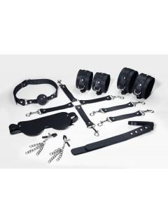 Набор Feral Feelings BDSM Kit 7 Black, наручники, поножи, коннектор, маска, паддл, кляп, зажимы
