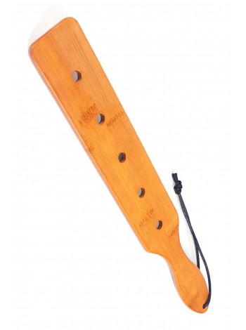 Fetish Tentation Paddle 5 Holes Bamboo, packed in a PE bag